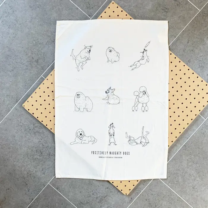 Positively Naughty Dogs tea towel